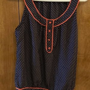 Navy blue with orange detail and buttons. Tag says large but it runs small